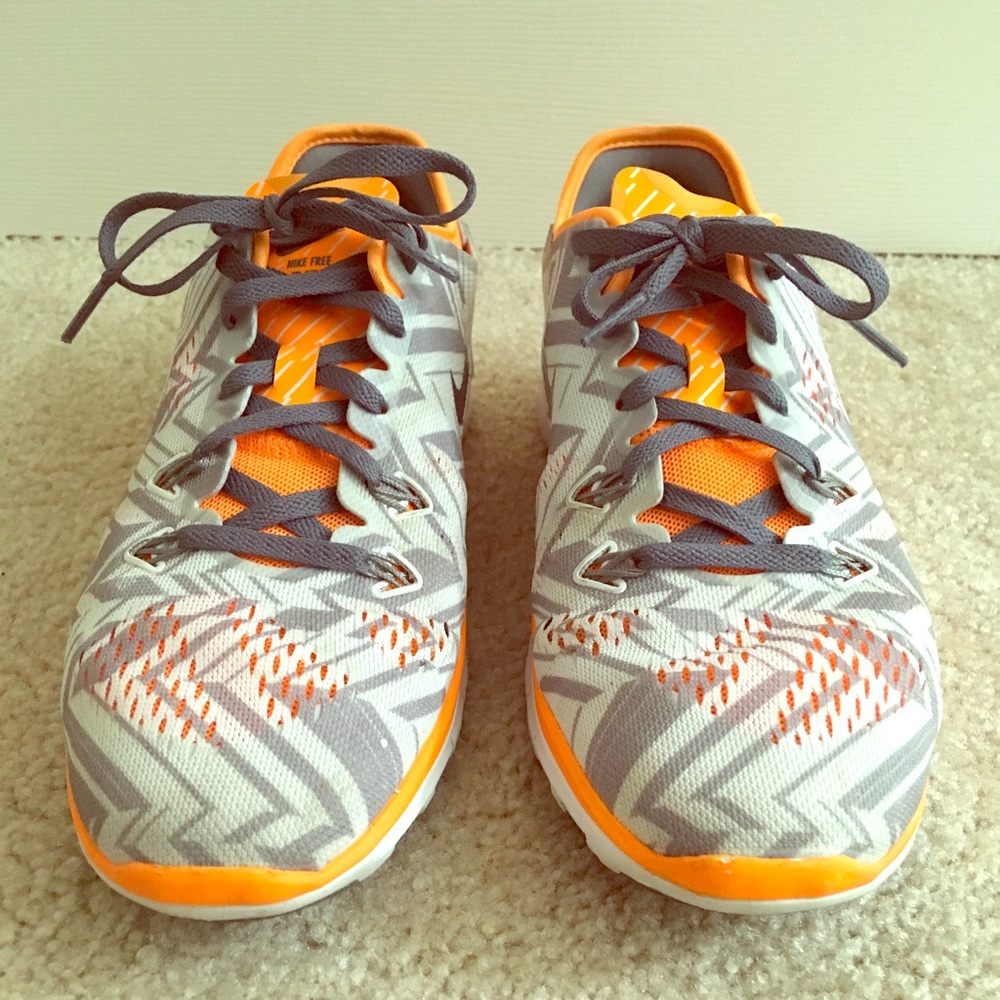 RARE Women’s Size 8 Orange and Silver Nike Frees